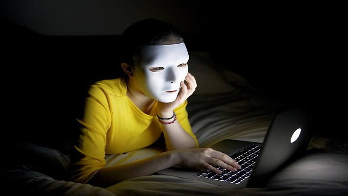 woman mask browsing internet 