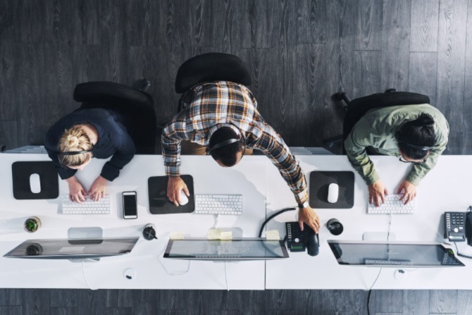 An overhead shot of office workers. Endpoint security is an essential aspect of an organization’s cybersecurity strategy
