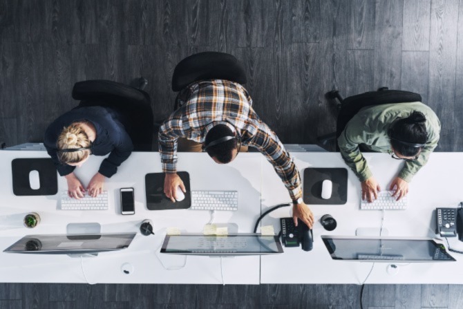 An overhead shot of office workers. Endpoint security is an essential aspect of an organization’s cybersecurity strategy